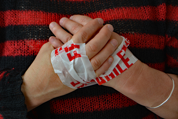 Cally Trench, Hands of Julia Maddison with FRAGILE tape